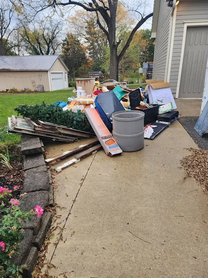 Dumpster being loaded with debris for Commercial Dumpster Rental in South Run
